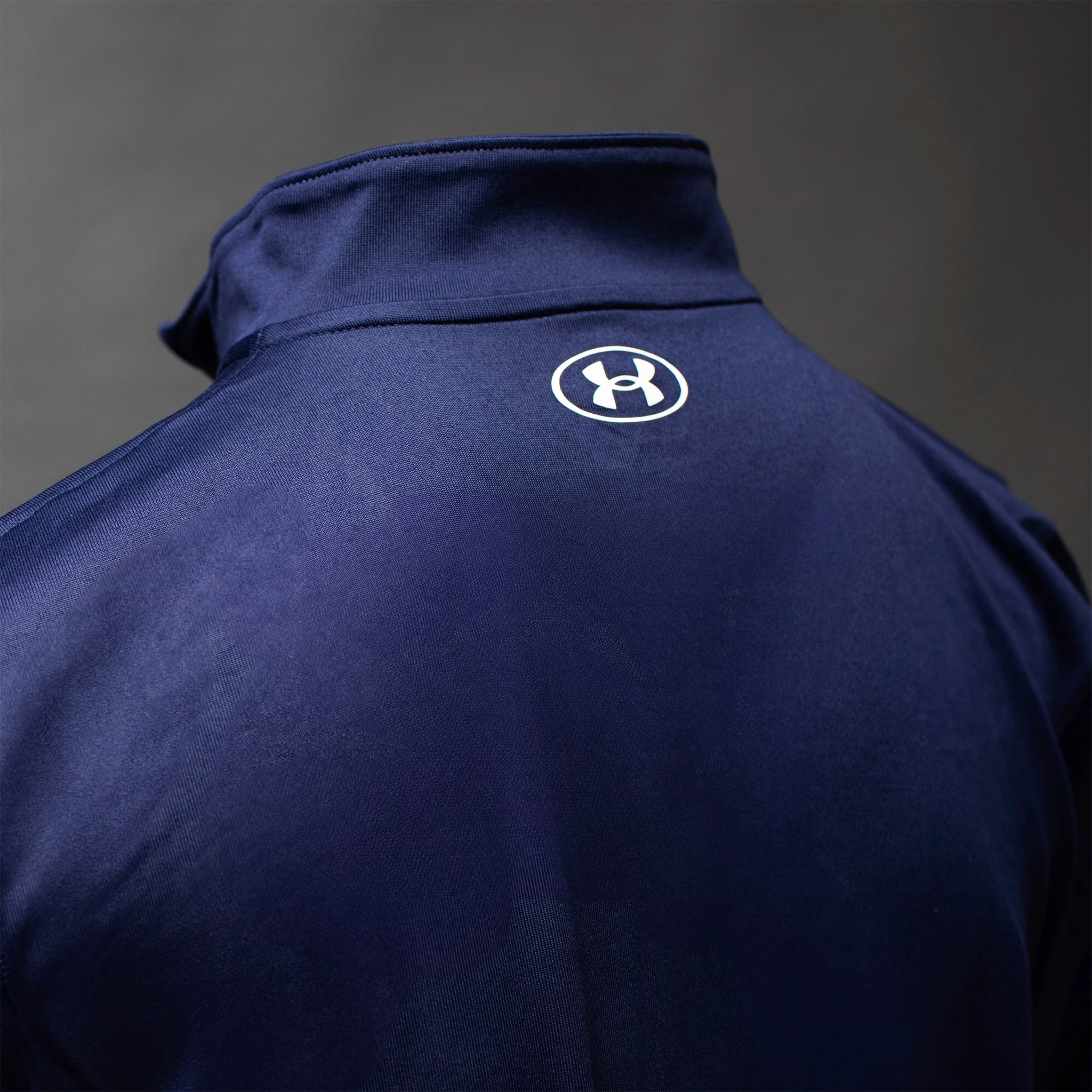 Under Armour logo on back of the Women's Teach Tech Half Zip Pullover in Midnight Navy